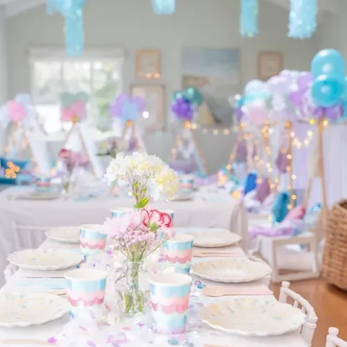 table with plates and cups for a birthday celebration